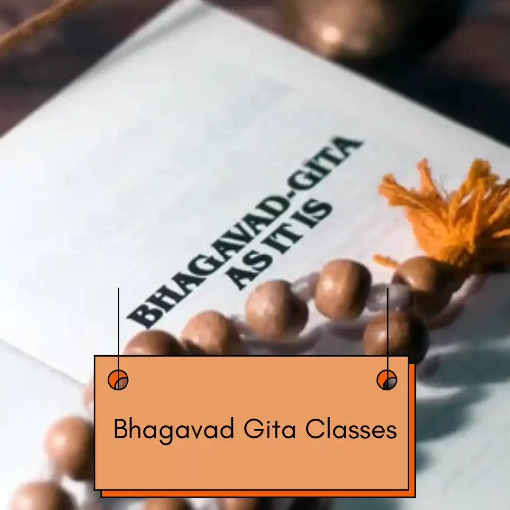Bhagavad Gita book with prayer beads.