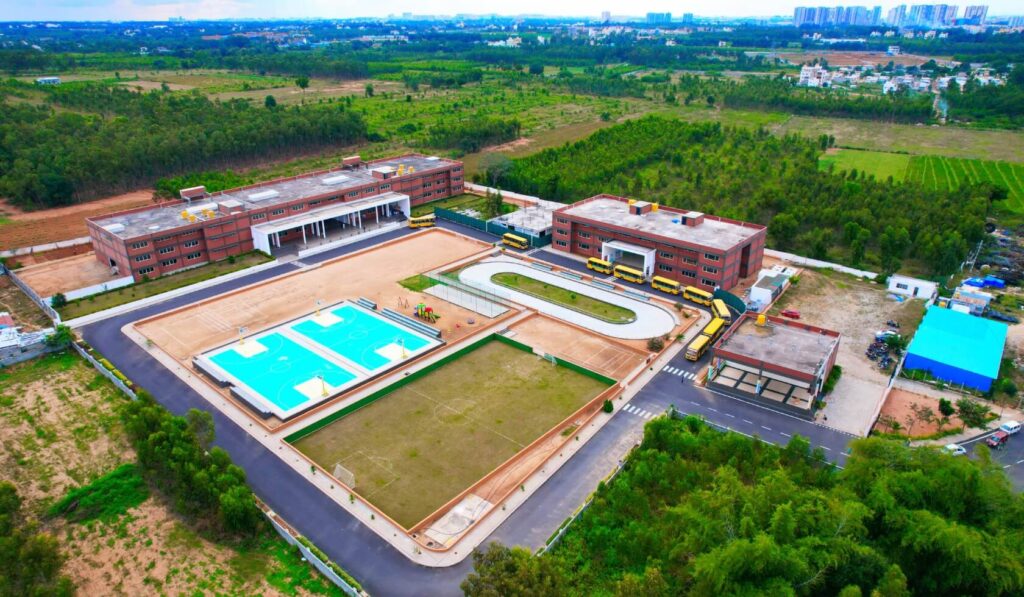 Kids participating in various school activities, including cultural dress-up, patriotic performances, classroom learning, yoga practice, and an aerial view of the school campus.