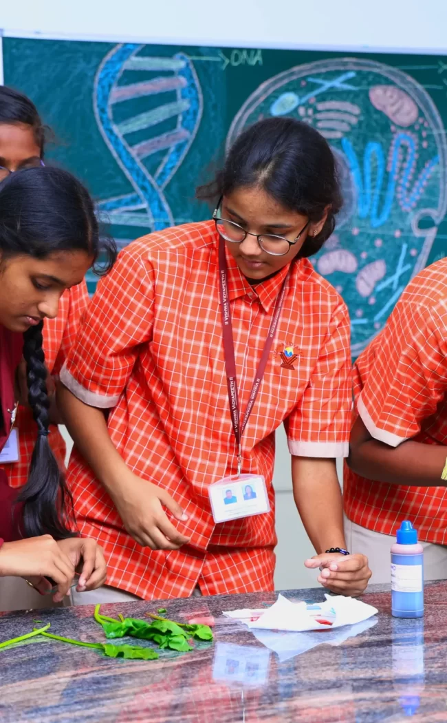 Students examining plant samples and using a microscope in a science lab.
