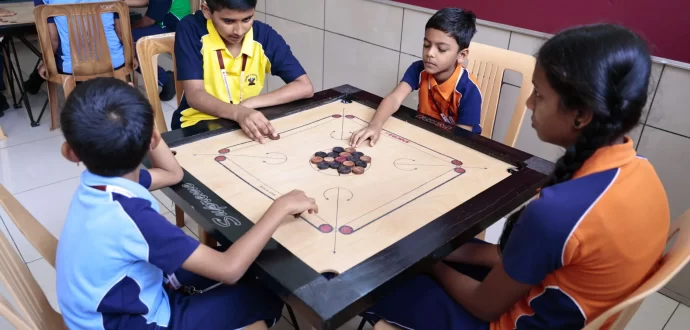 Group of students are playing carrom